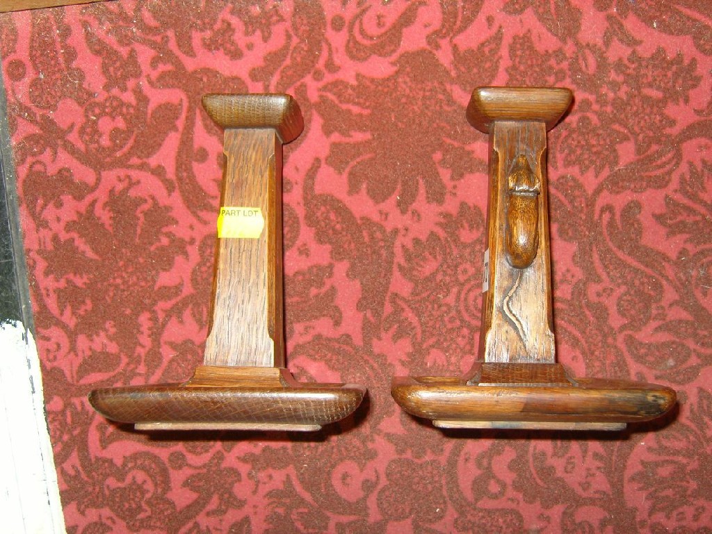 Appraisal: A pair of carved oak Mouseman candlesticks of -sided form