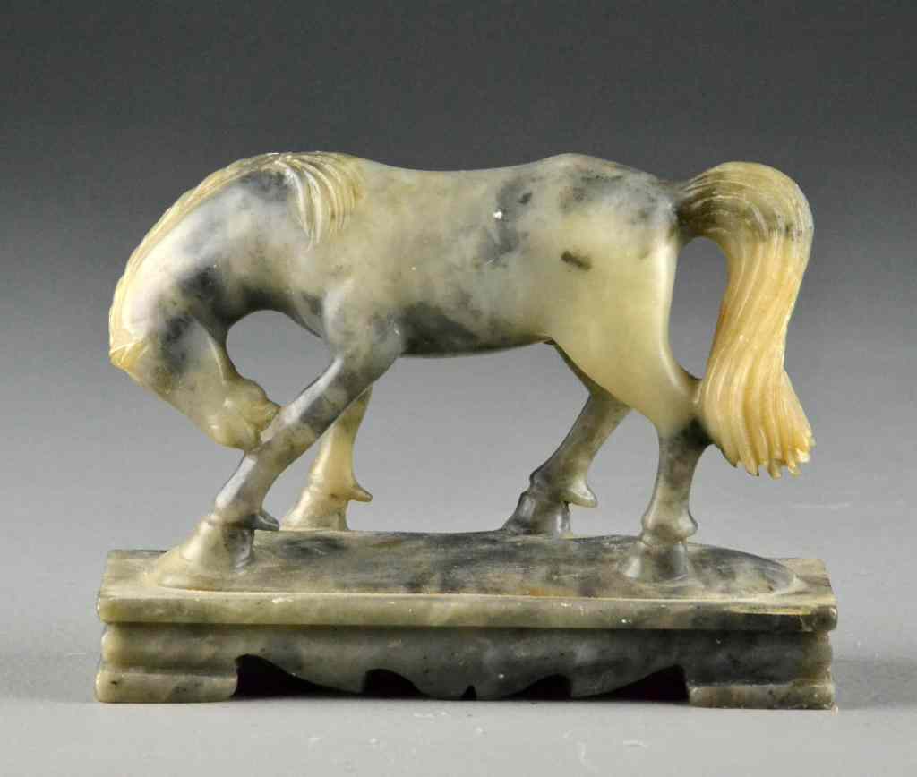 Appraisal: Chinese Qing Carved Soapstone HorseDepicting bowing horse raised on rectangular