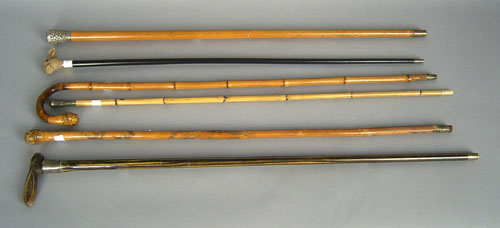 Appraisal: Six canes include two with rabbit head grips