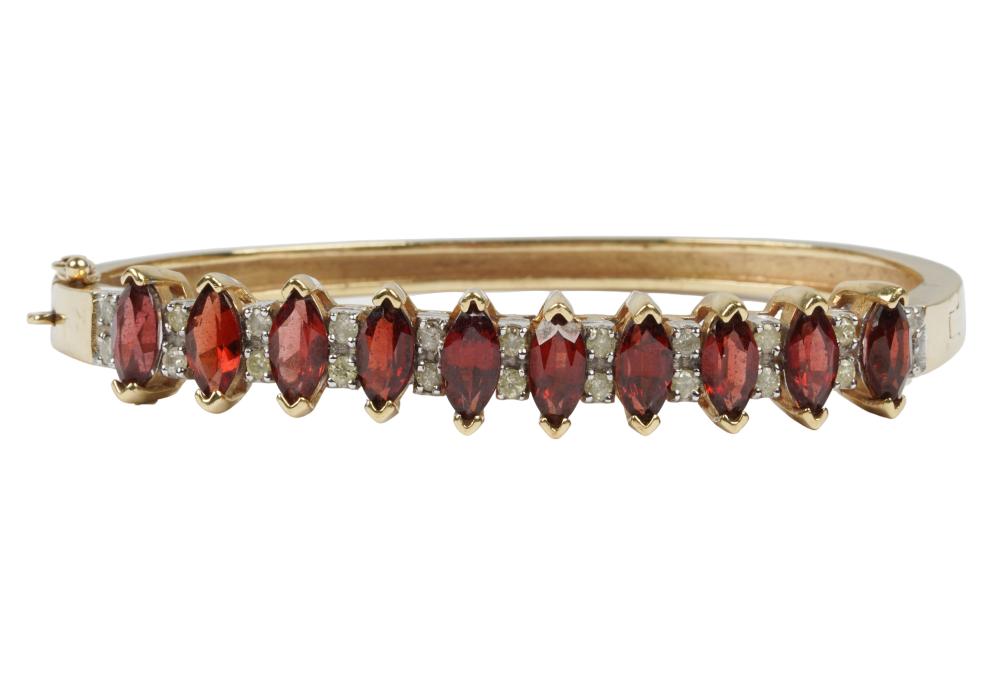 Appraisal: KARAT YELLOW GOLD GARNET DIAMOND BANGLE BRACELETcontaining marquise mixed cut