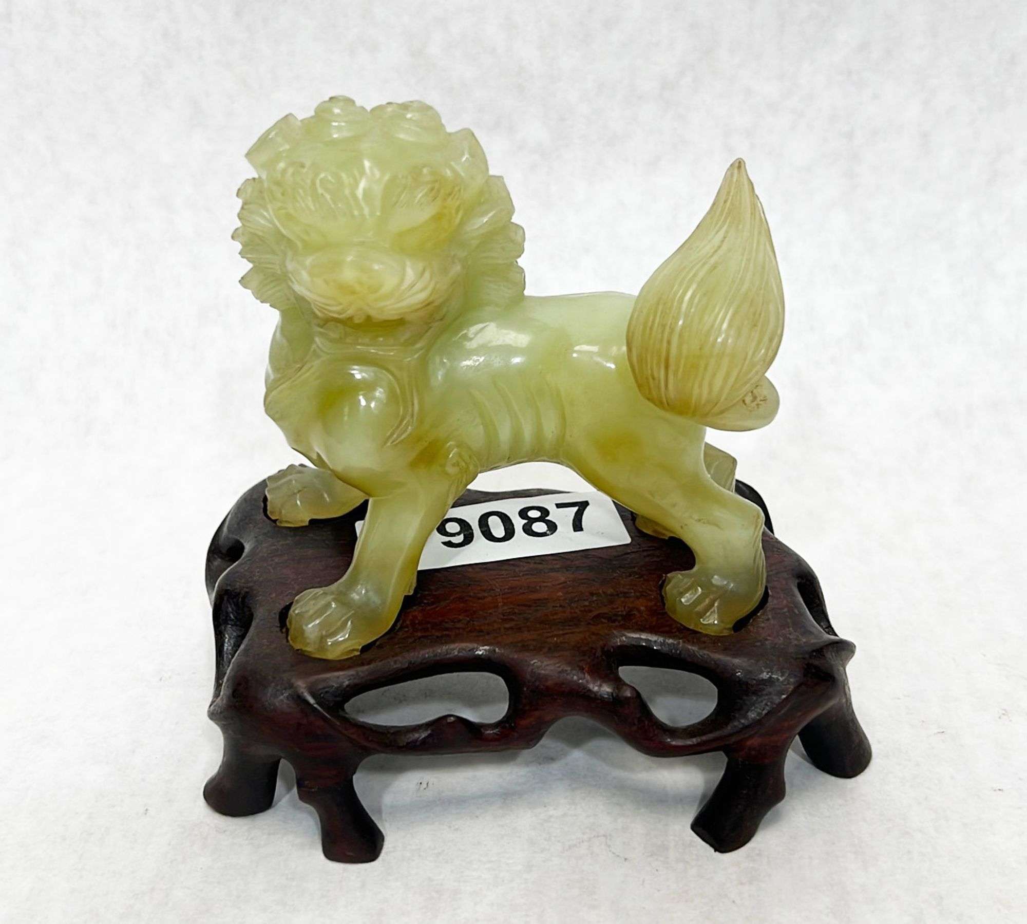 Appraisal: Chinese carved hardstone foo dogEarly to mid thC Stands in