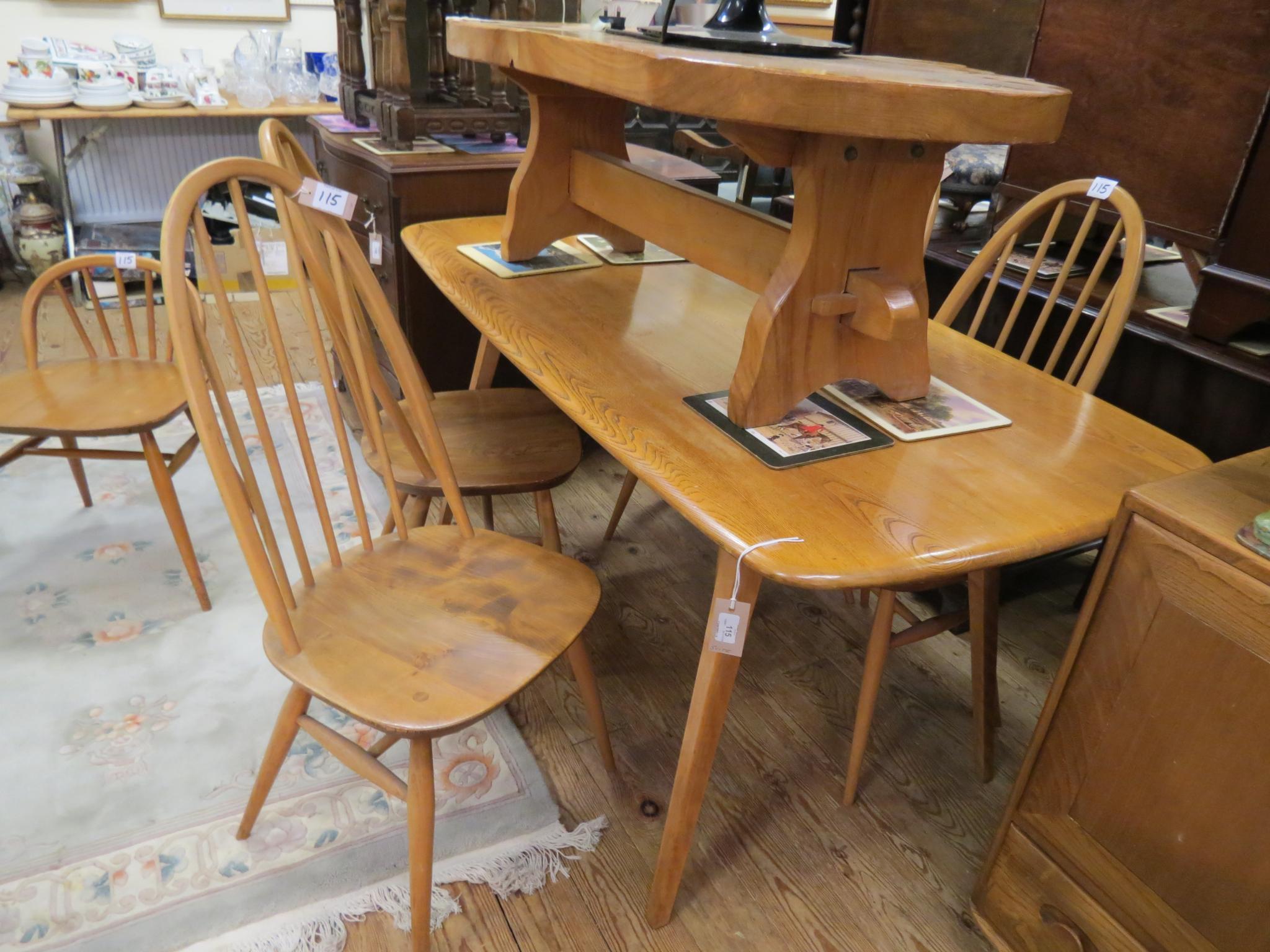 Appraisal: An Ercol golden elm dining suite six-seater table set of