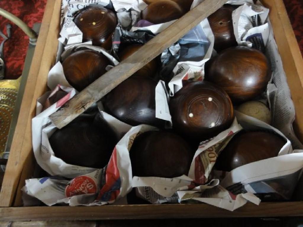 Appraisal: A pine box containing ten lignum vitae bowling balls together