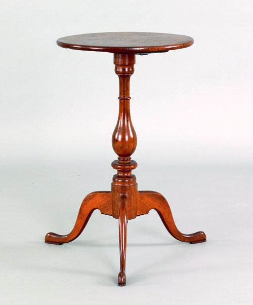 Appraisal: Pennsylvania cherry candlestand ca with a circular top and baluster