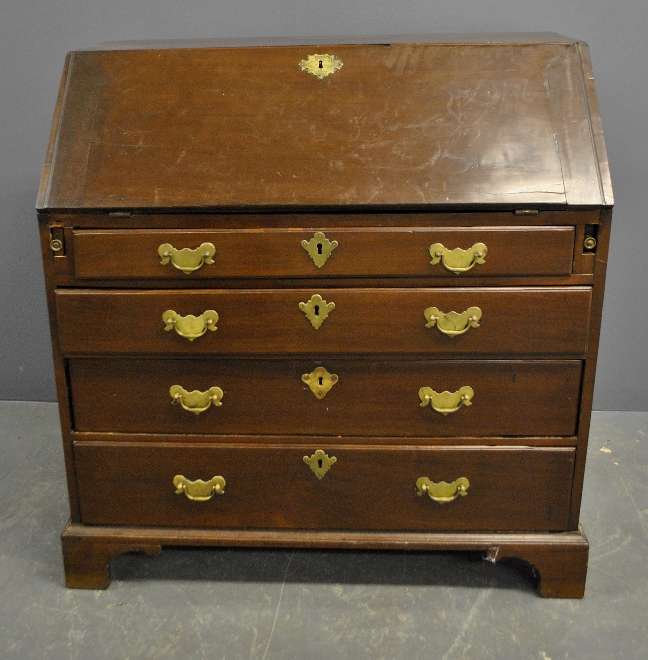 Appraisal: - George III mahogany slant-lid desk with pigeon holed and