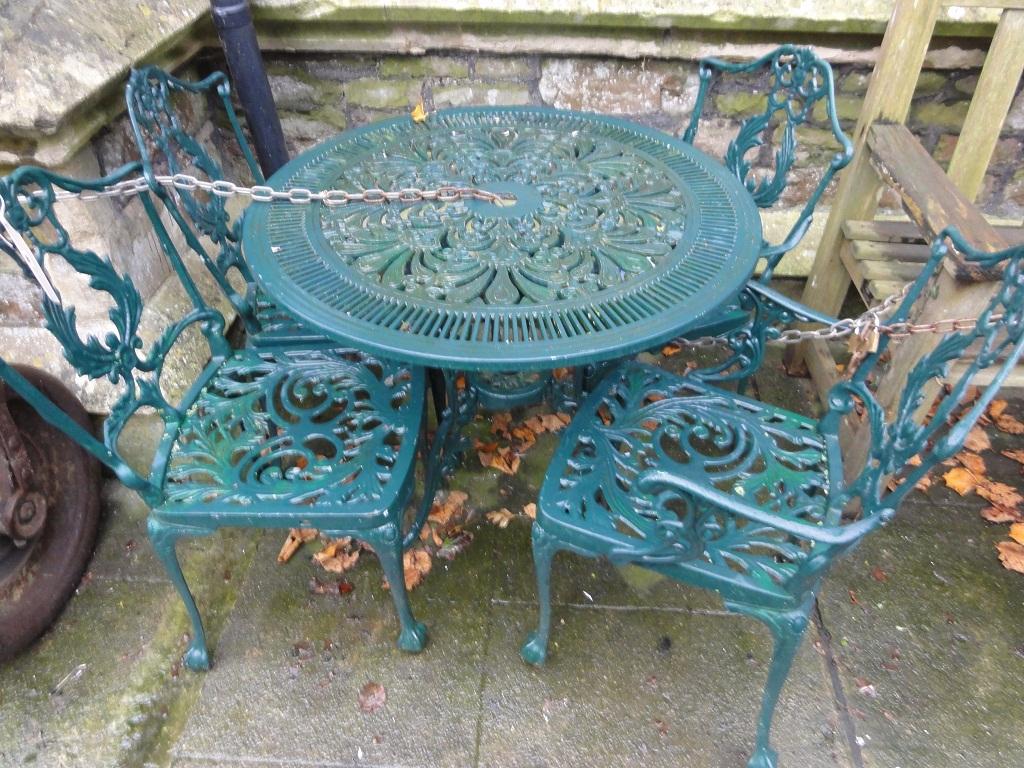 Appraisal: A decorative cast aluminium patio table of circular form with