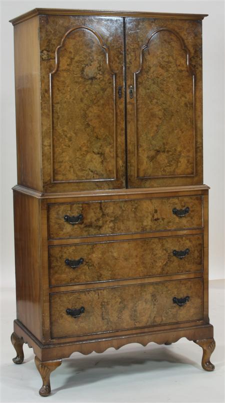 Appraisal: A Queen Anne style walnut linen press the projected moulded