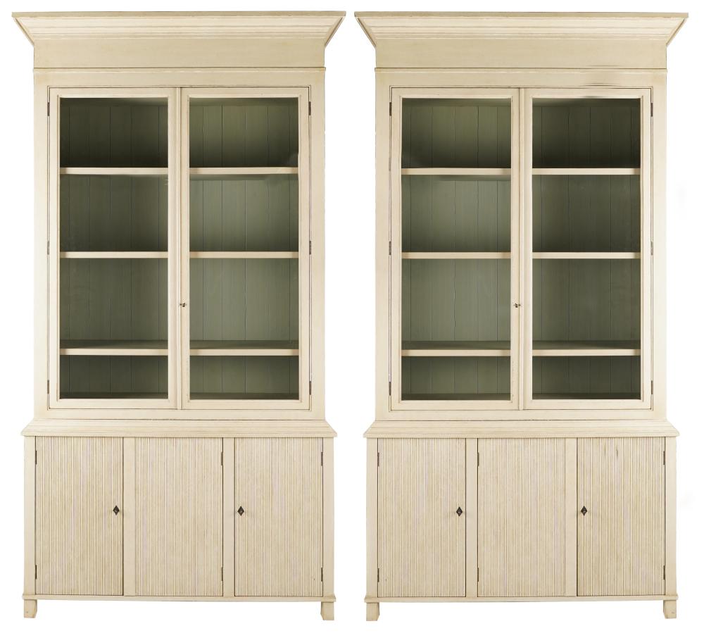 Appraisal: PAIR OF GUSTAVIAN-STYLE PAINTED BOOKCASE CABINETSmodern each constructed in two