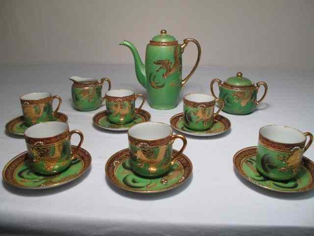 Appraisal: Green gilt Moriage style demitasse tea set total pieces Green