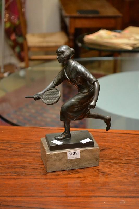 Appraisal: AN ART DECO BRONZE TENNIS PLAYER ON A MARBLE BASE