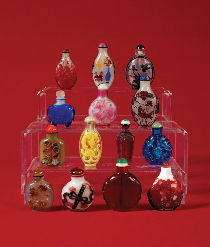 Appraisal: FOURTEEN CHINESE OVERLAY AND CARVED GLASS SNUFF BOTTLES In various