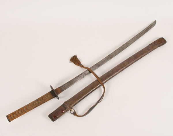 Appraisal: Japanese katana sword shagreen and fabric wrapped handle with ornament