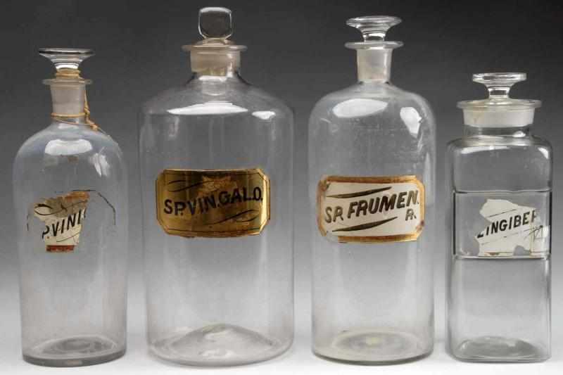 Appraisal: Lot of Large Druggist Shop Bottles Description Circa to Four