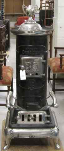 Appraisal: CAST-IRON CYLINDER PARLOR STOVE ''Modern Crescent'' model Henry N Clark