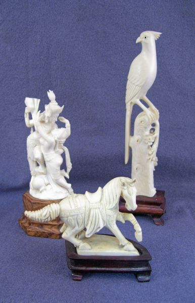 Appraisal: pcs Oriental Figural Ivory Includes Longtailed bird on stand measures