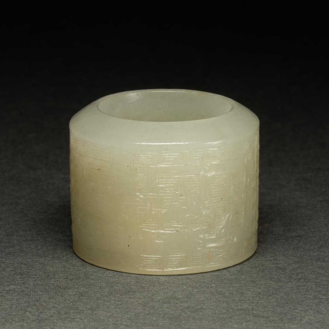 Appraisal: CHINESE WHITE JADE ARCHER'S RING Chinese white jade archer's ring