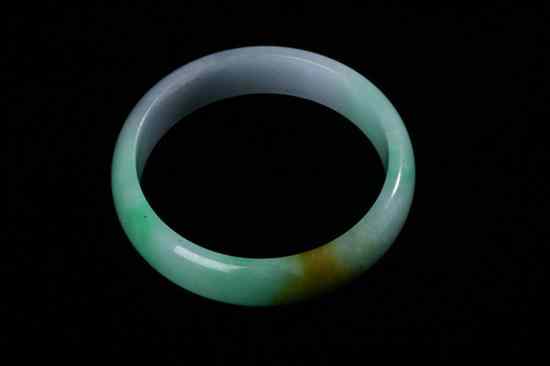 Appraisal: CHINESE GREEN JADE BANGLE - in diam