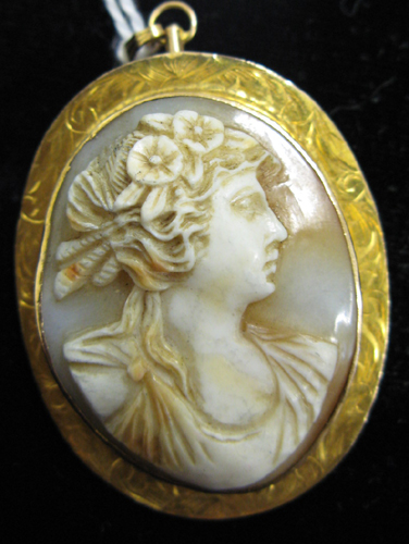 Appraisal: VICTORIAN CAMEO BROOCH PENDANT an oval portrait of a young