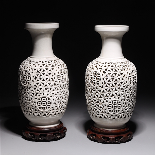 Appraisal: Pair of white glazed Chinese latticework vases each with wood