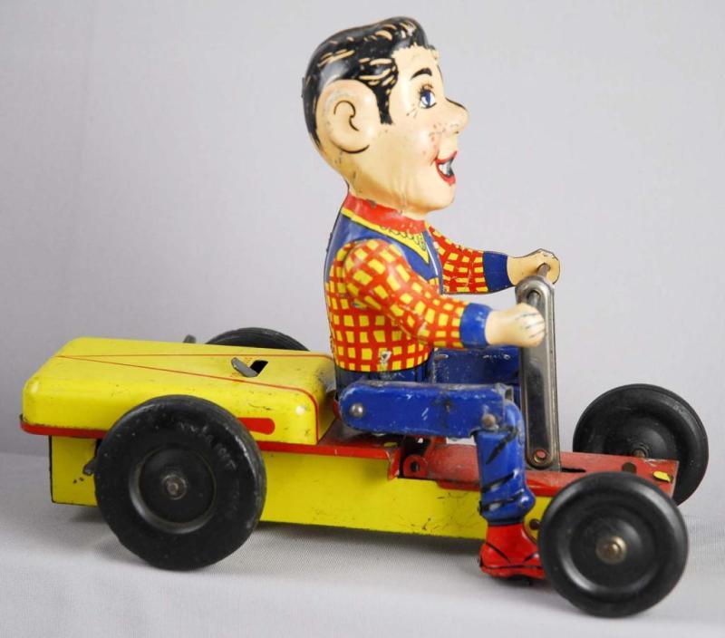 Appraisal: Tin Wind-Up Hump Mobile Toy Description Working Made by Nylint