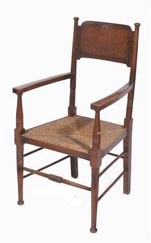 Appraisal: A late Victorian oak open armchair after a model by