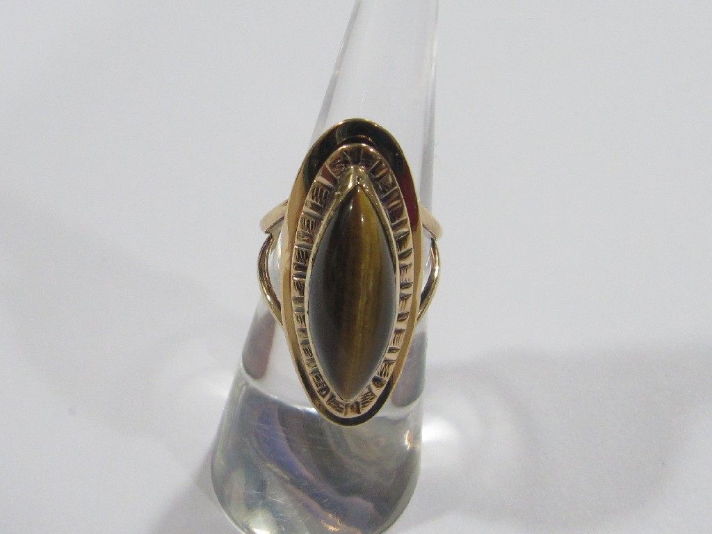 Appraisal: Nine carat gold marquise tigers eye single stone ring