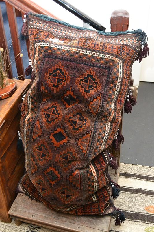 Appraisal: A LARGE PERSIAN SITTING CUSHION WITH BEADED TASSELS A LARGE