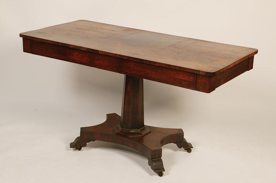 Appraisal: A REGENCY ROSEWOOD CENTRE TABLE with a rectangular top with