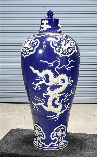 Appraisal: Tall Chinese blue glazed covered vase with white relief dragon