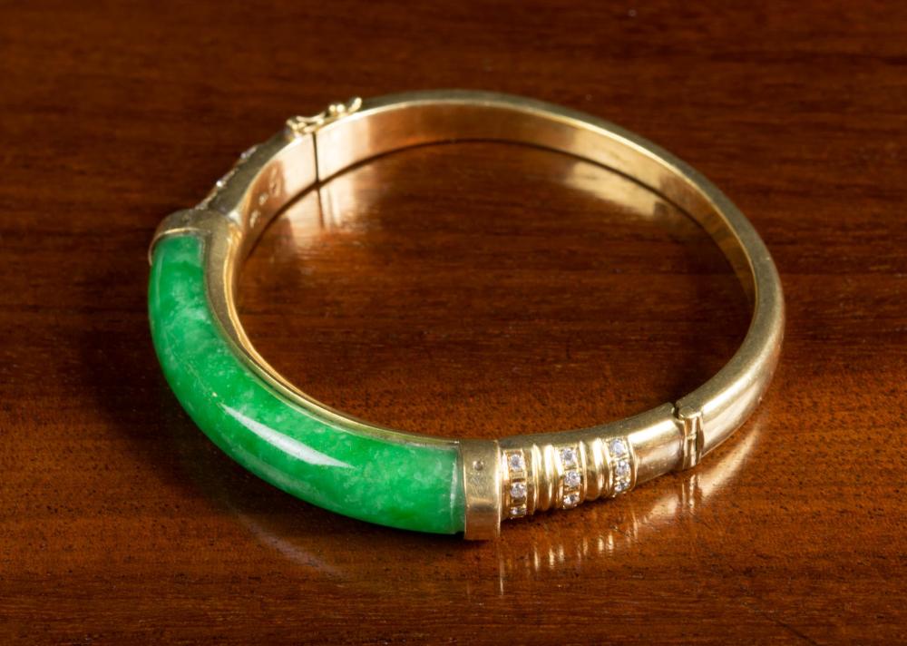 Appraisal: KARL LAGERFELD JADE AND EIGHTEEN KARAT GOLD BANGLE The oval