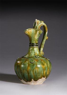 Appraisal: A small Chinese pottery sancai-glazed ewer the handle and shoulder