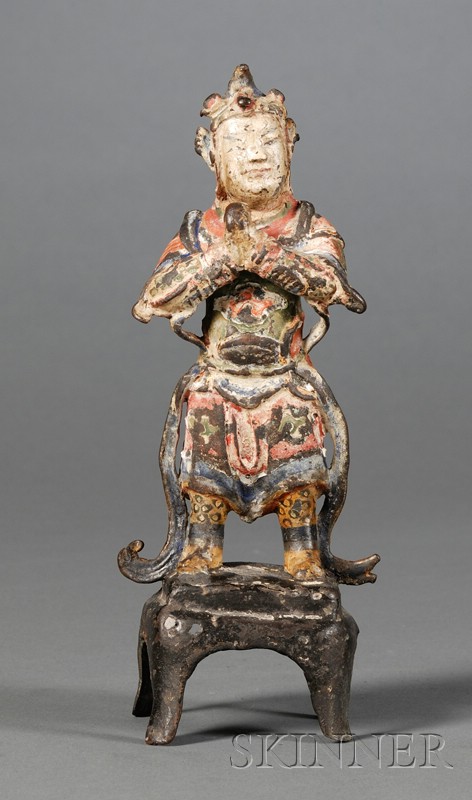 Appraisal: Bronze Deity China Ming period th early th century standing