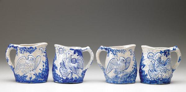 Appraisal: DEDHAM Crackleware four Night and Morning pitchers Indigo stamps x