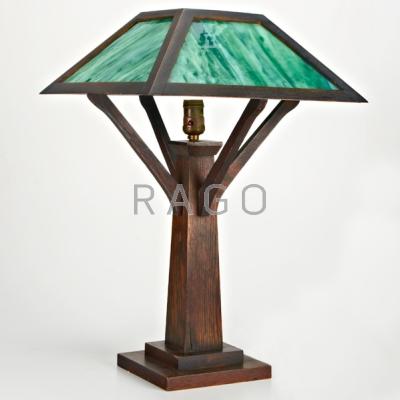 Appraisal: ARTS CRAFTS Table lamp th c Slag glass and oak