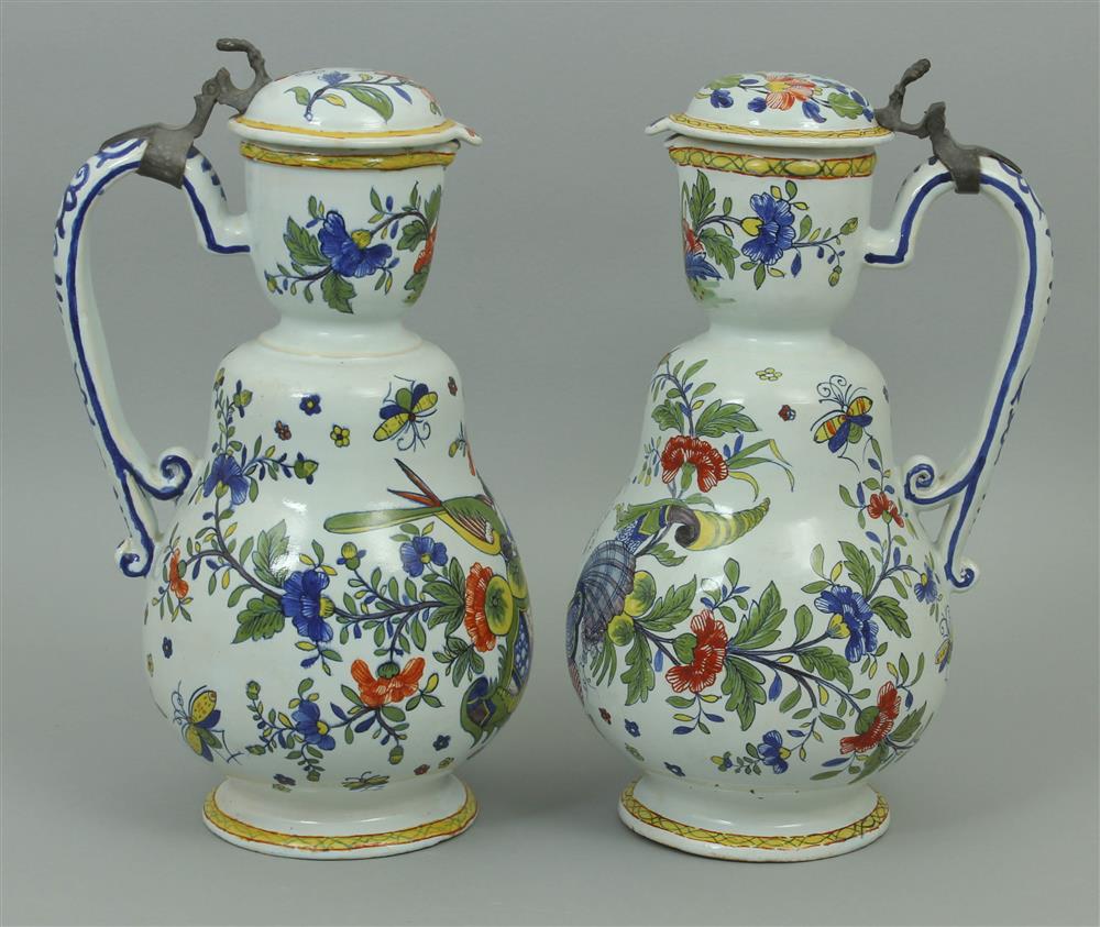 Appraisal: PAIR OF CONTINENTAL PEWTER MOUNTED POLYCHROME FAIENCE JUGS each having