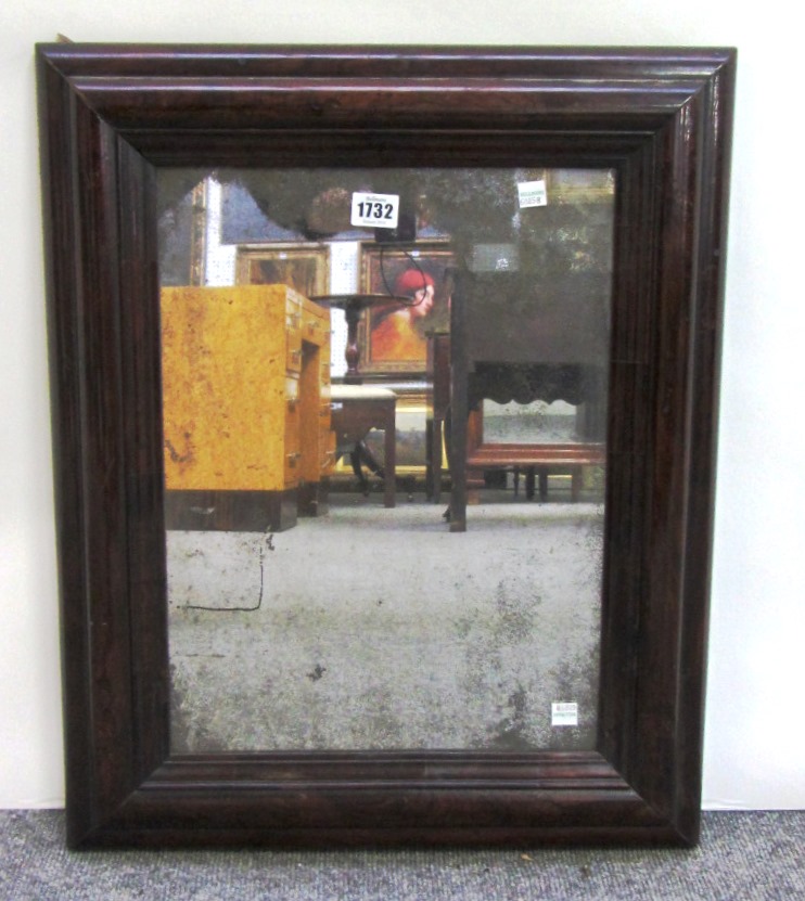 Appraisal: An early th century walnut cushion frame wall mirror cm