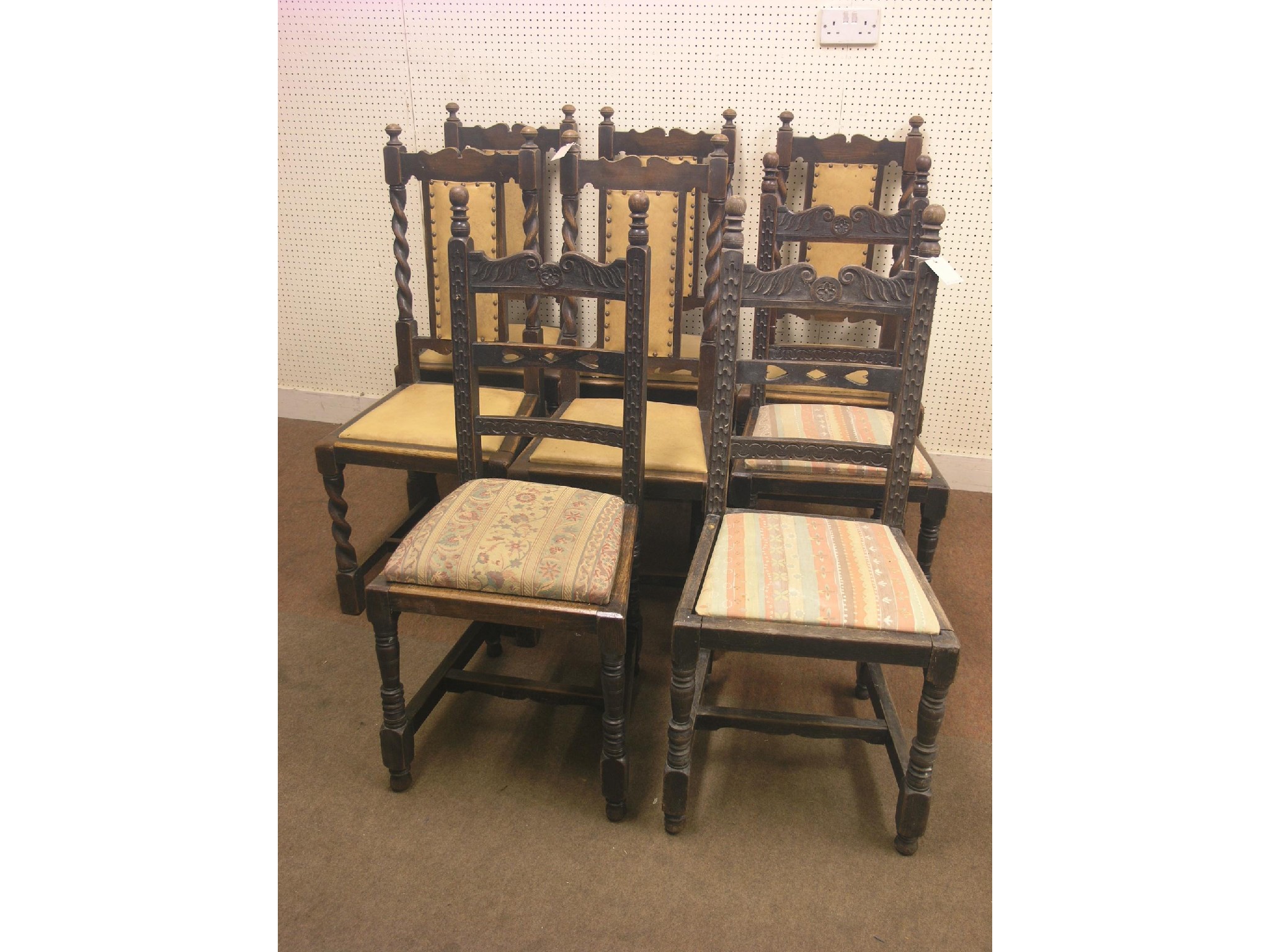 Appraisal: A set of six Jacobean-style dark oak dining chairs with