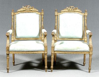 Appraisal: Pair Italian neoclassical armchairs gilt wood with ribbon and foliate