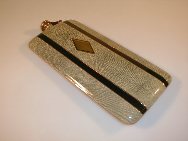 Appraisal: A motoring connected pocket spirit flask with enamelled decoration in