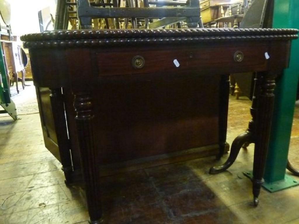 Appraisal: A th century mahogany fold over top tea table with