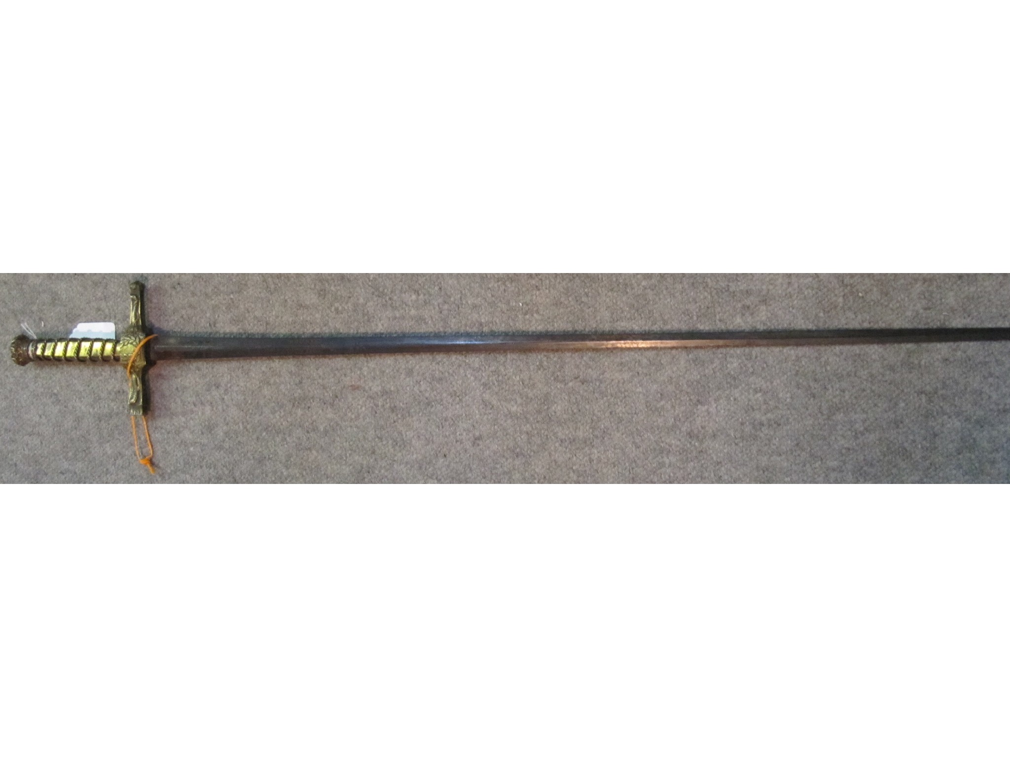 Appraisal: A French sword with gilt hilt and crown finial the