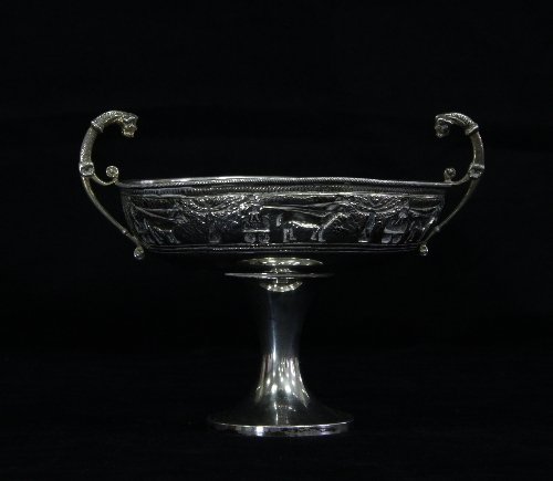 Appraisal: An standard silver tazza the scroll handles with lion mask