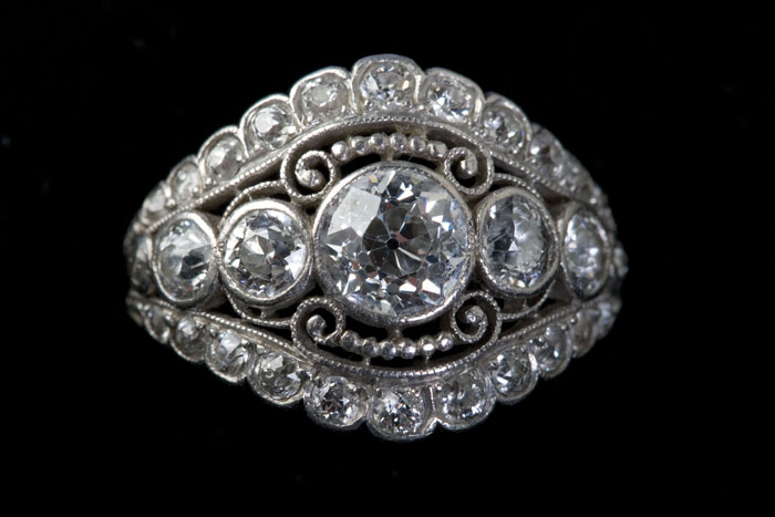 Appraisal: DIAMOND AND PLATINUM RING The ring set with a center