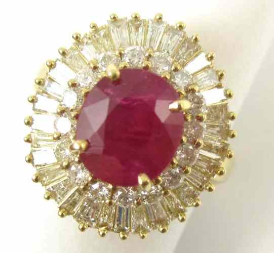 Appraisal: RUBY DIAMOND AND FOURTEEN KARAT GOLD RING set with round-cut