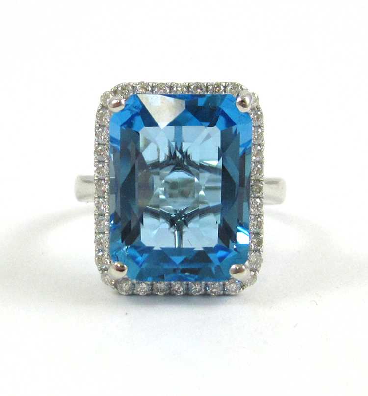 Appraisal: SWISS BLUE TOPAZ AND FOURTEEN KARAT GOLD RING The white