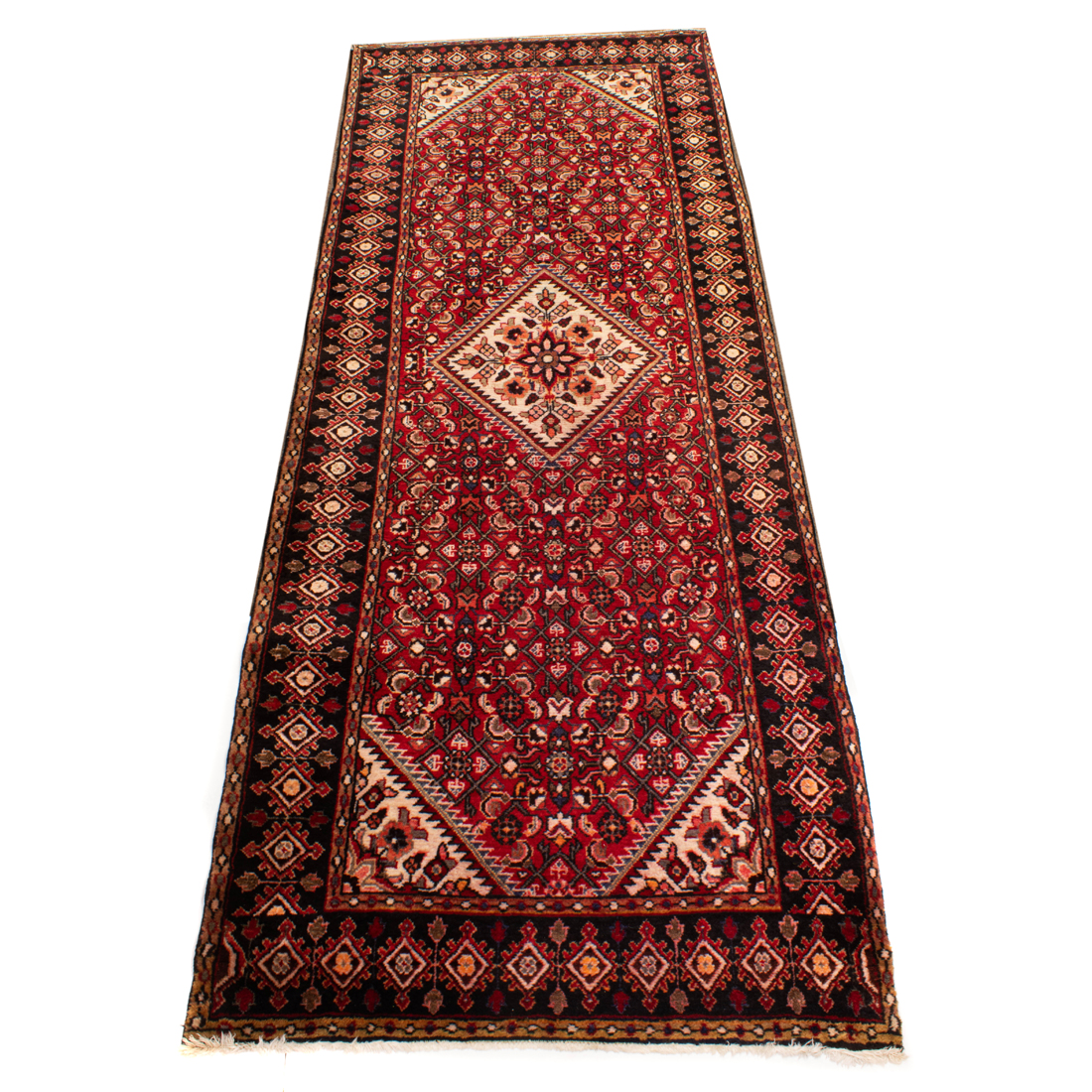 Appraisal: A PERSIAN HAMADAN RUNNER A Persian Hamadan runner ' x