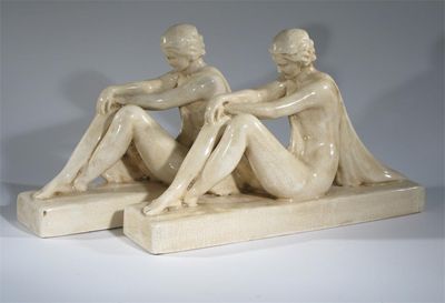 Appraisal: A pair of French Art Deco earthenware figures each modelled