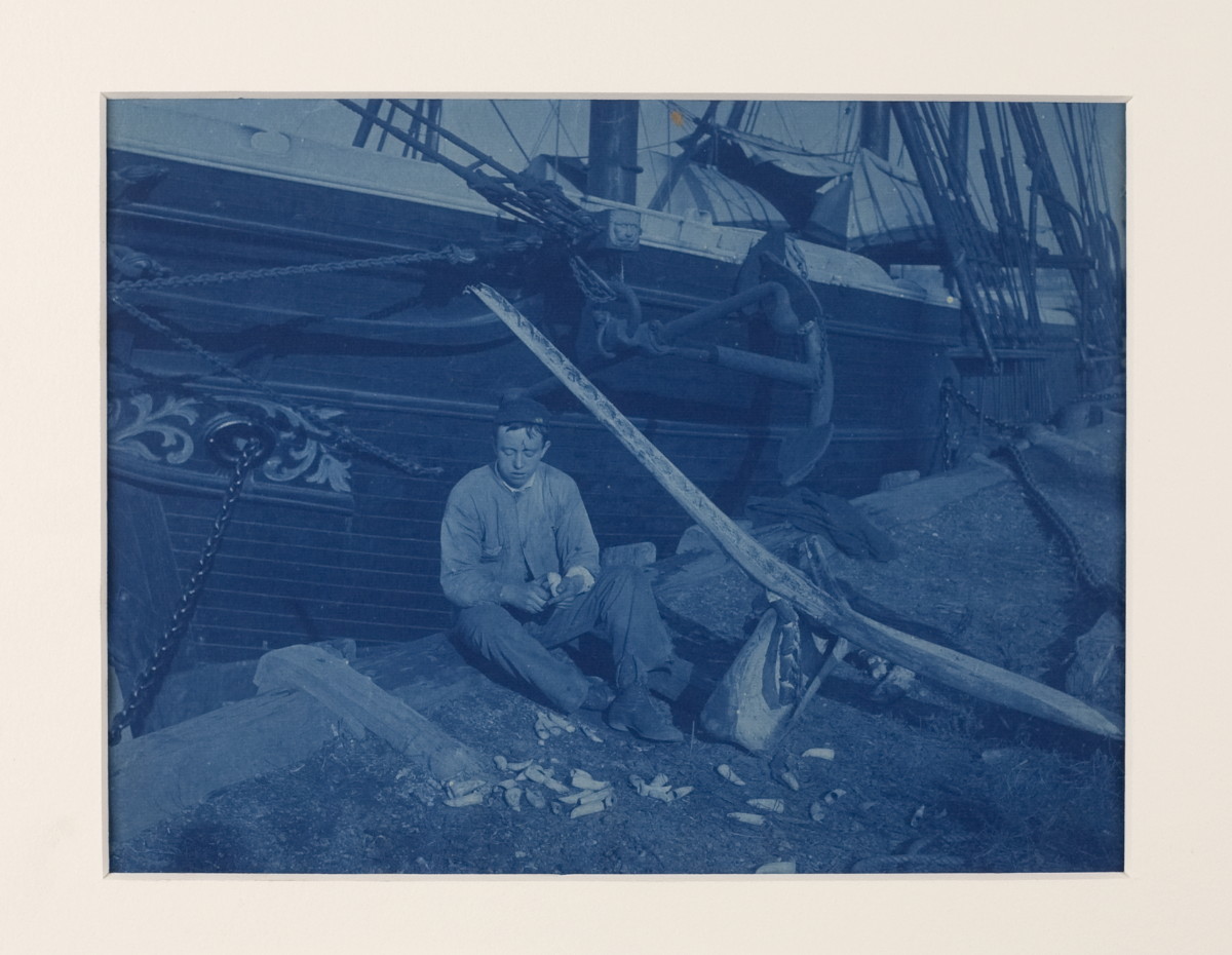 Appraisal: RARE PHOTOGRAPH CYANOTYPE OF A YOUNG SAILOR CARVING A SPERM