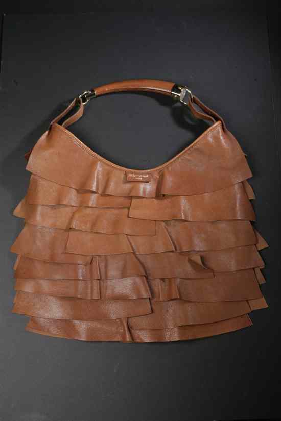 Appraisal: YVES SAINT LAURENT BROWN LEATHER ST TROPEZ HANDBAG With chocolate