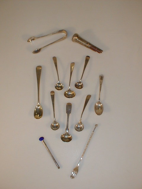 Appraisal: An assortment of thC silver condiment spoons a pickle fork